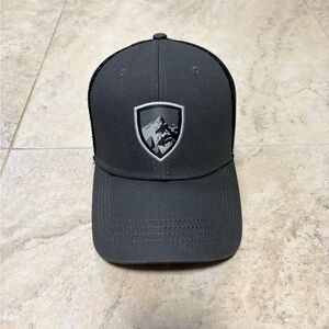 KÜHL Low Profile Trucker Hat featuring a custom woven patch on the front.